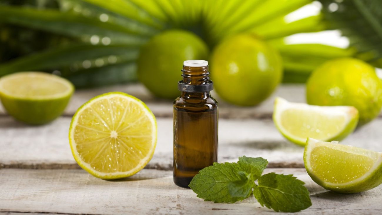 Orangen-Allergie, ein Fläschen inmitten einiger Limetten